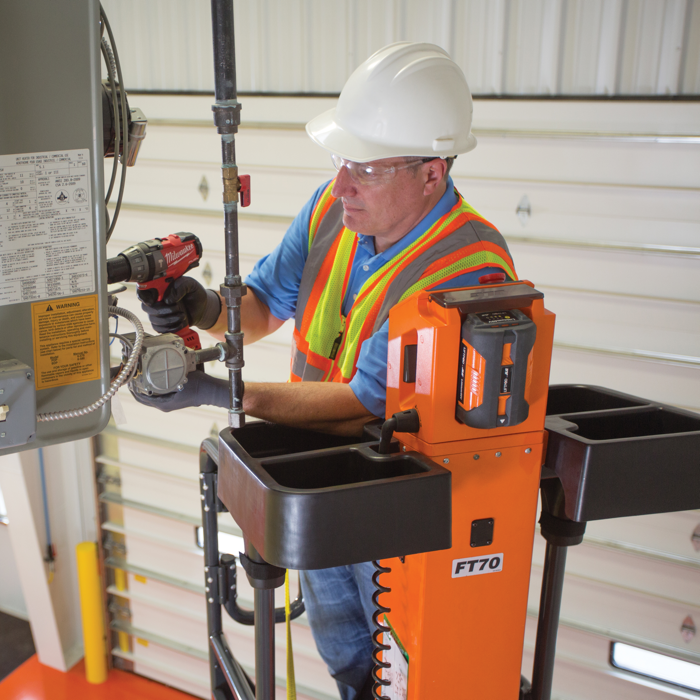 Operator completing work at height with JLG® LiftPod