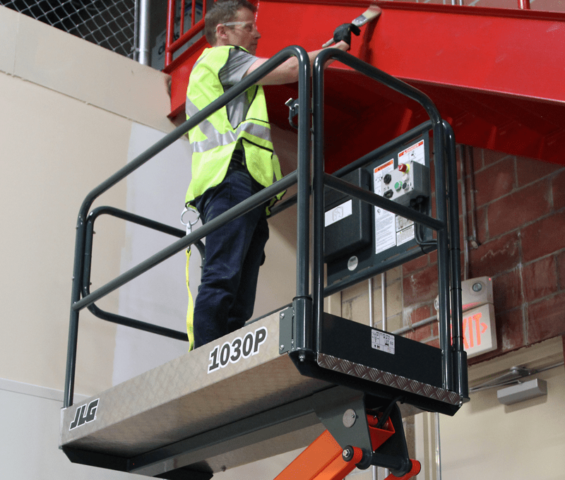 Operator hanging drywall with JLG® EcoLift