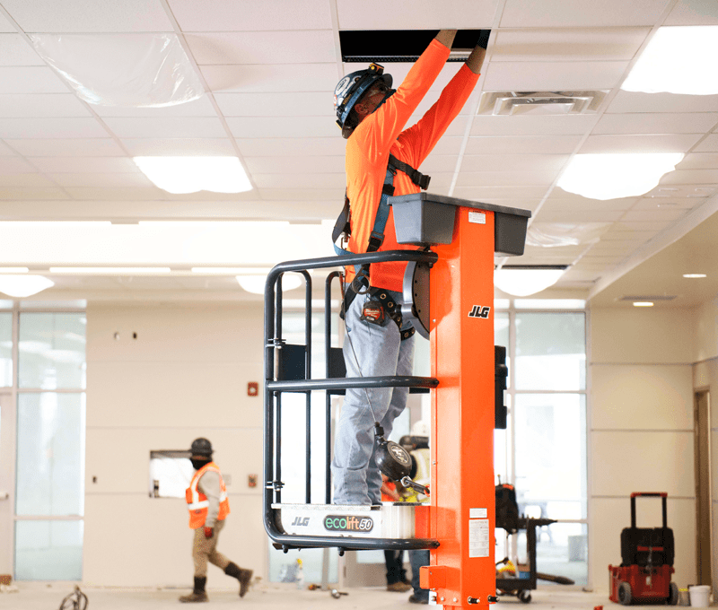 Operator accessing ductwork with JLG® EcoLift