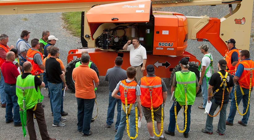 Trainer delivering hands-on safety training to operators