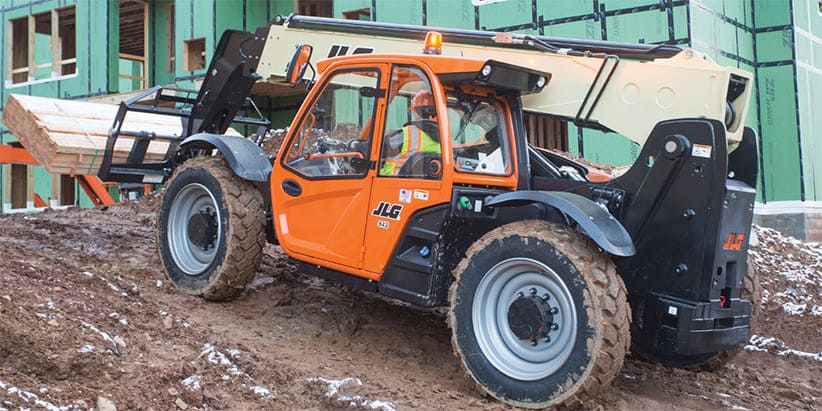 JLG Telescopic Handler with Ride Control Carrying Lumber