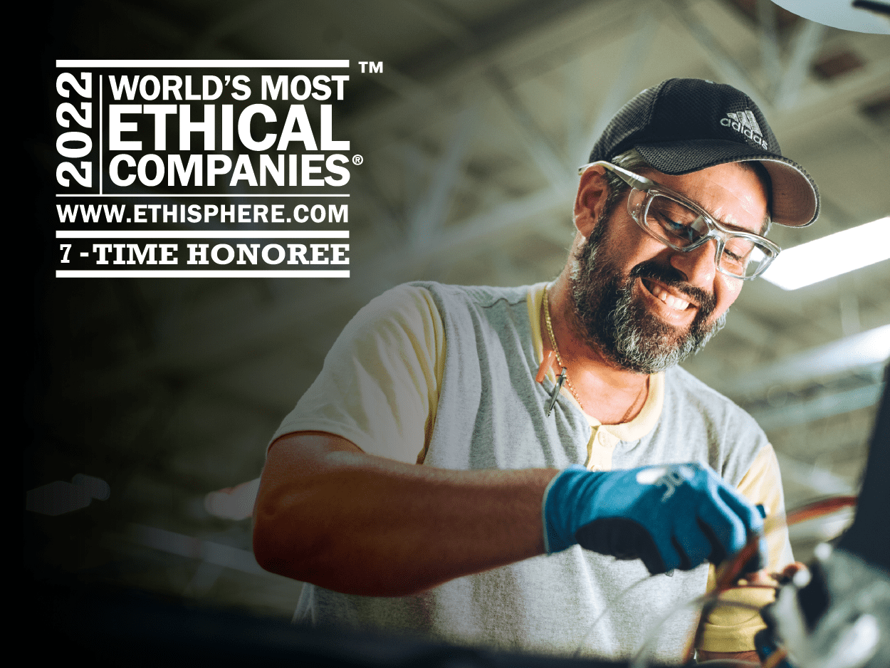 Image of male production worker smiling with white 2022 World's Most Ethical Companies logo