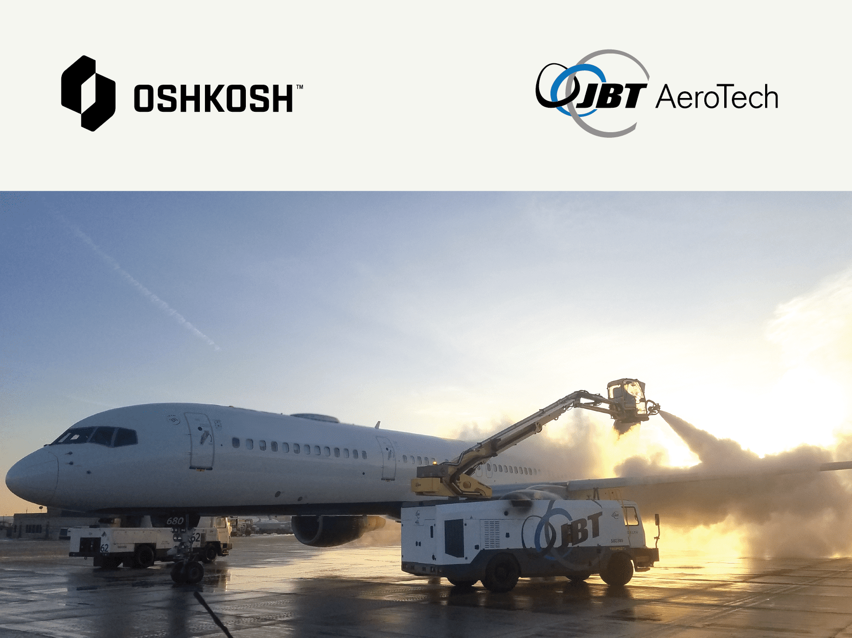 Image of airplane and ground support vehicle with Oshkosh logo and JBT AeroTech logo